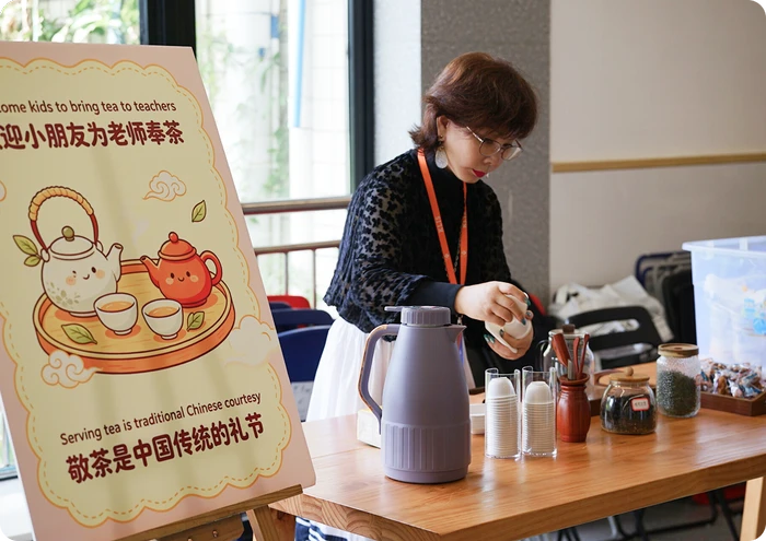Students serving tea to teachers in a traditional Chinese courtesy ceremony at KLIS Teacher Appreciation Week