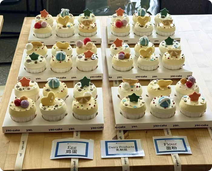 Handcrafted cupcakes with egg, dairy and flour allergy labels donated by parents for the KLIS potluck